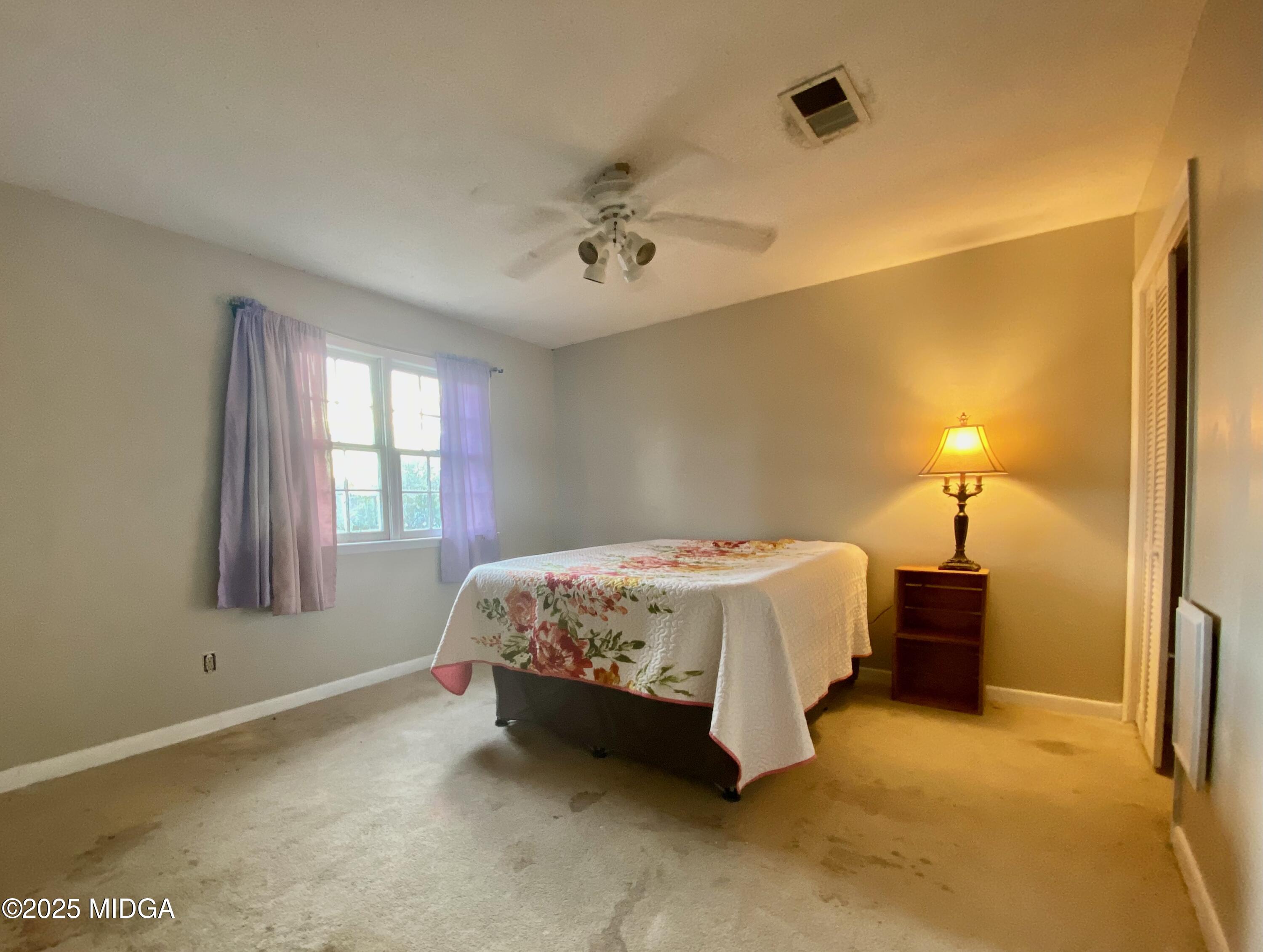 117 Laura Lane Fort Valley, GA 31030 - Photo 20 of 31 a bedroom with a bed and a window