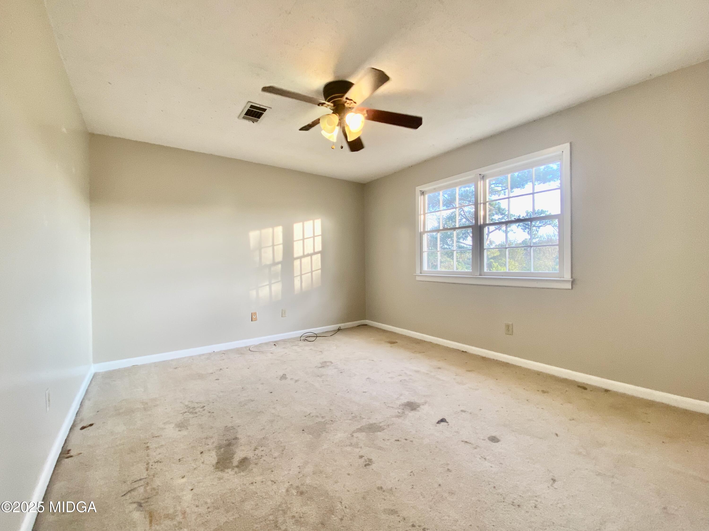 117 Laura Lane Fort Valley, GA 31030 - Photo 21 of 31 a view of an empty room with a window