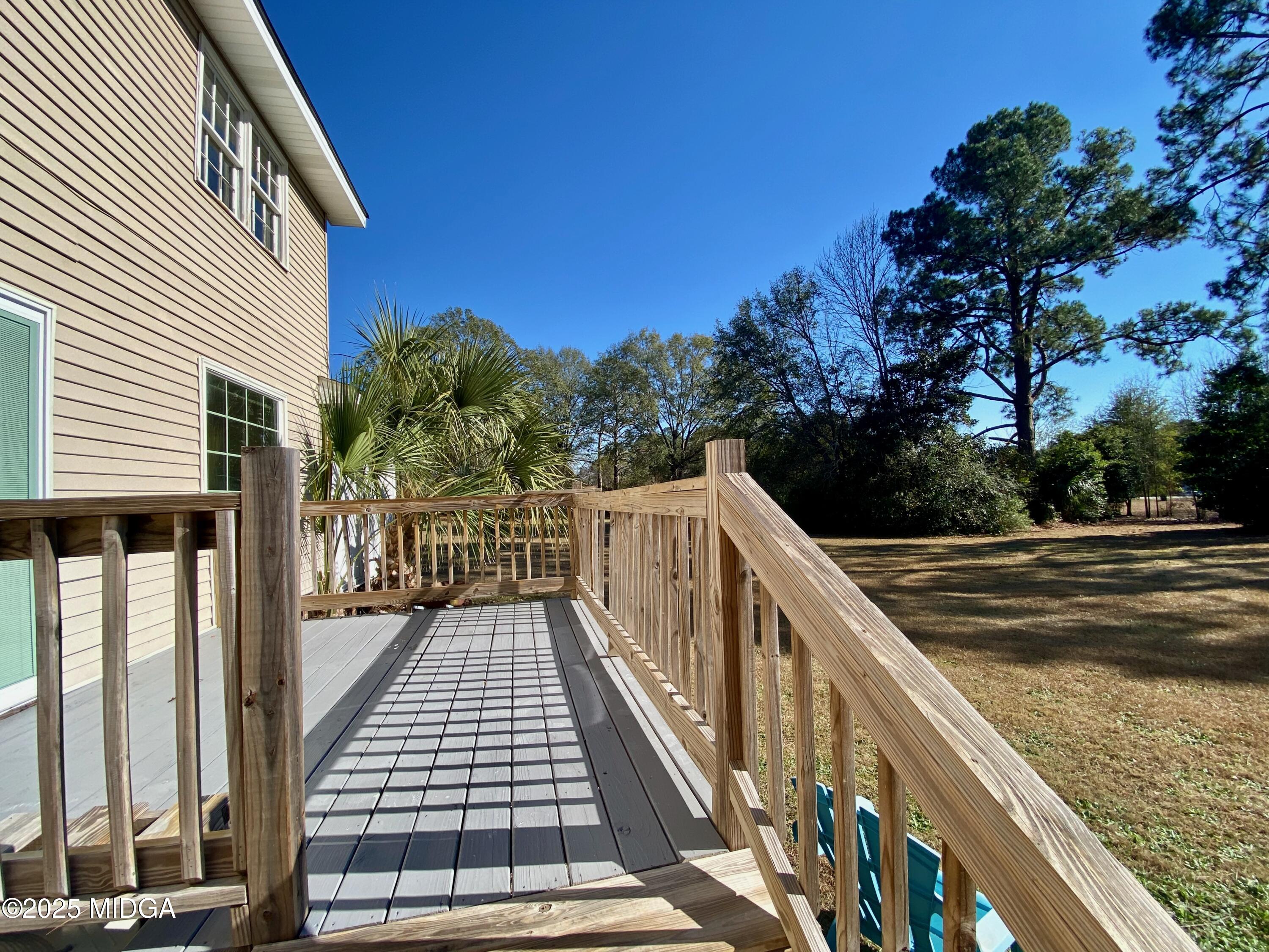 117 Laura Lane Fort Valley, GA 31030 - Photo 24 of 31 a view of balcony with wooden floor and fence
