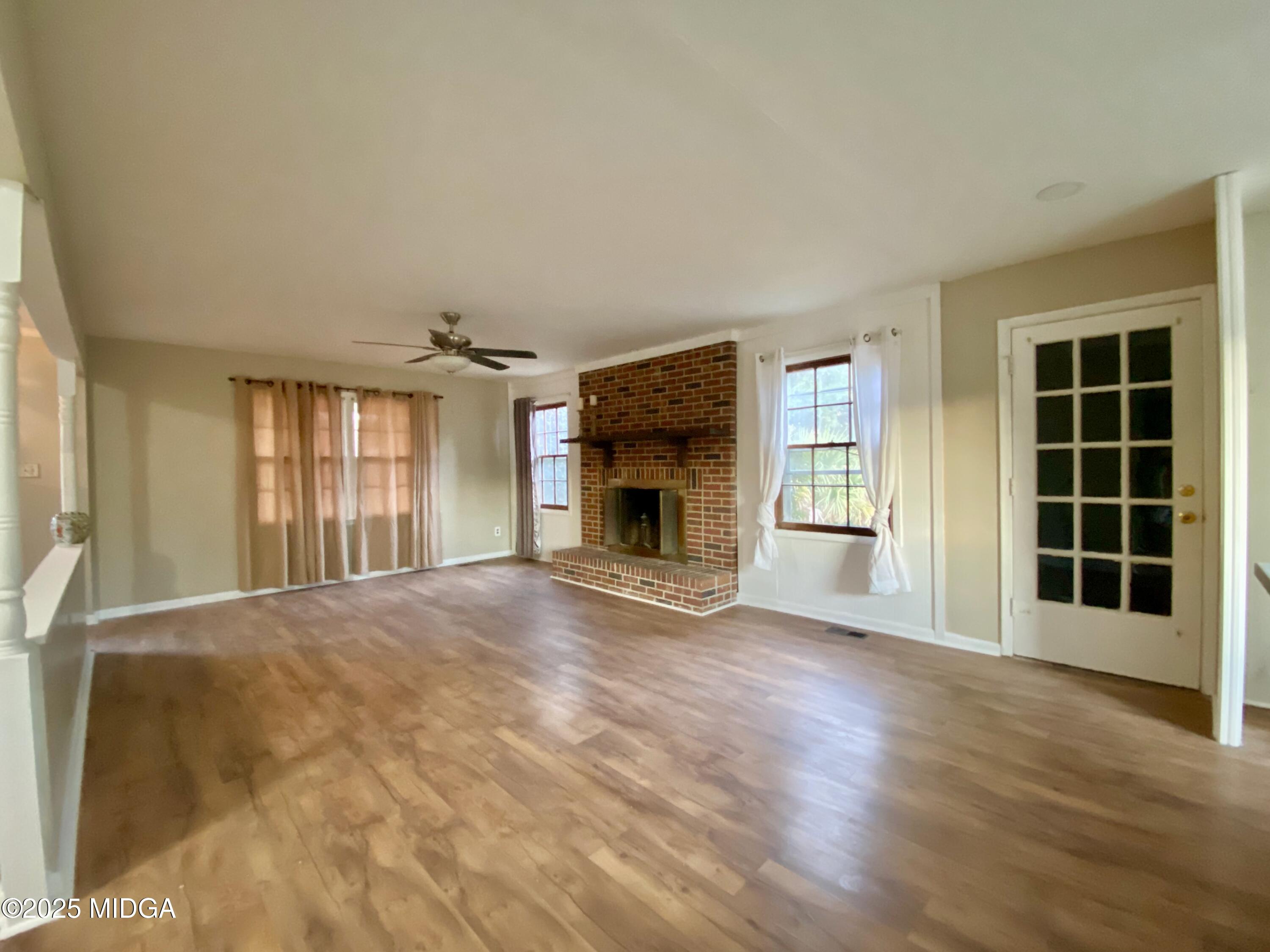 117 Laura Lane Fort Valley, GA 31030 - Photo 4 of 31 a view of an empty room with a window and fireplace