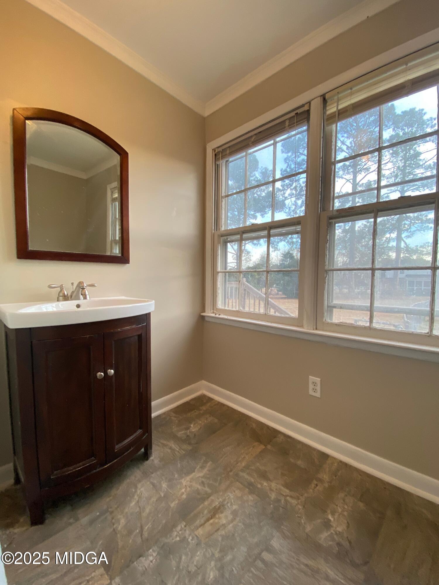 117 Laura Lane Fort Valley, GA 31030 - Photo 10 of 31 a bathroom with a double vanity sink and mirror