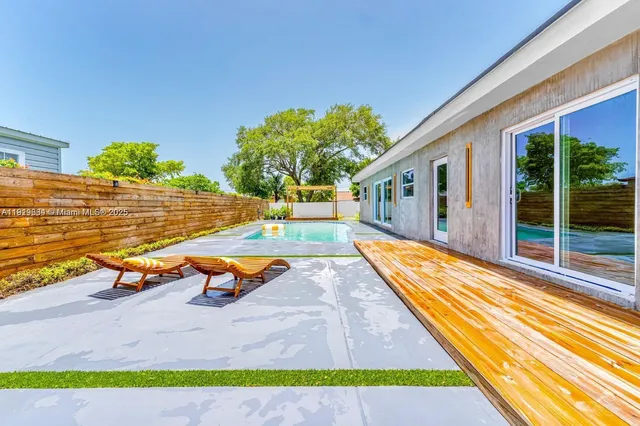 a view of swimming pool with lounge chair