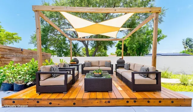 a view of swimming pool with an outdoor seating area