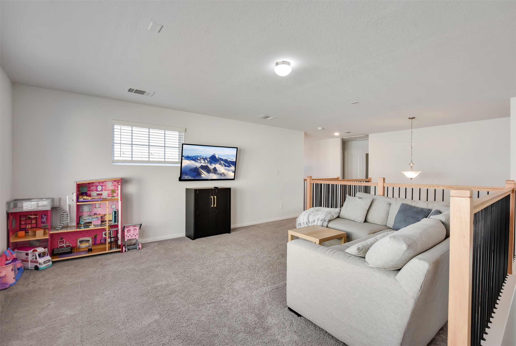 605 Oleander Loop Buda, TX 78610 - Photo 23 of 32 a living room with furniture and a flat screen tv