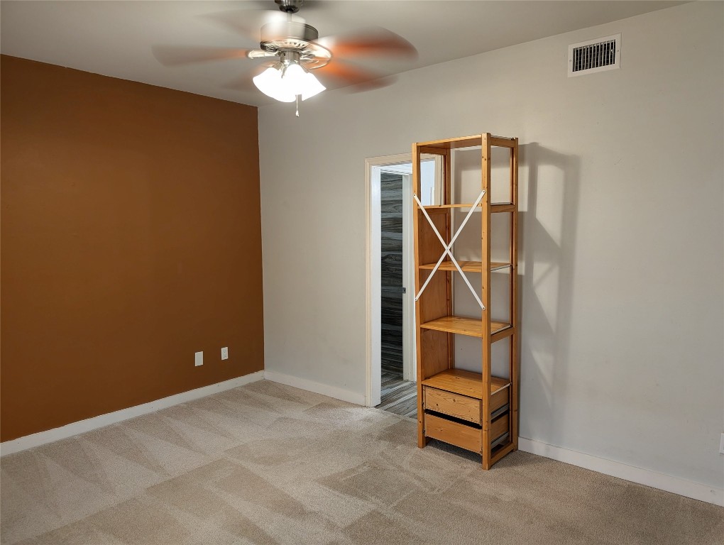 2529 Rio Grande Street, Unit 6 Austin, TX 78705 - Photo 15 of 19 wooden floor in an empty room with a chandelier fan