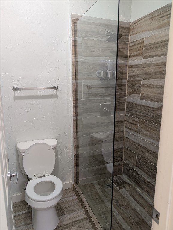 2529 Rio Grande Street, Unit 6 Austin, TX 78705 - Photo 17 of 19 a bathroom with a toilet and a shower