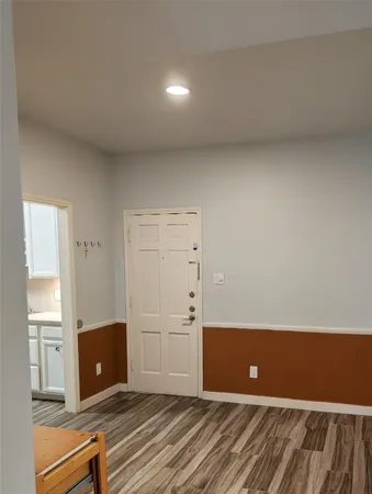 a kitchen with granite countertop a stove and a refrigerator