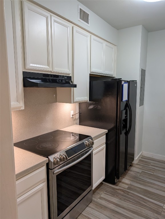 2529 Rio Grande Street, Unit 6 Austin, TX 78705 - Photo 6 of 19 a kitchen with granite countertop a stove and a refrigerator
