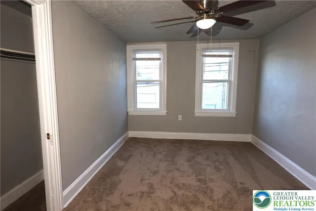 a view of an empty room with a window