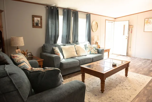 a living room with furniture and a window