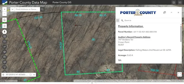 a front view of a house with cars parked