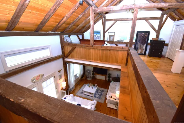a view of living room with furniture and a window
