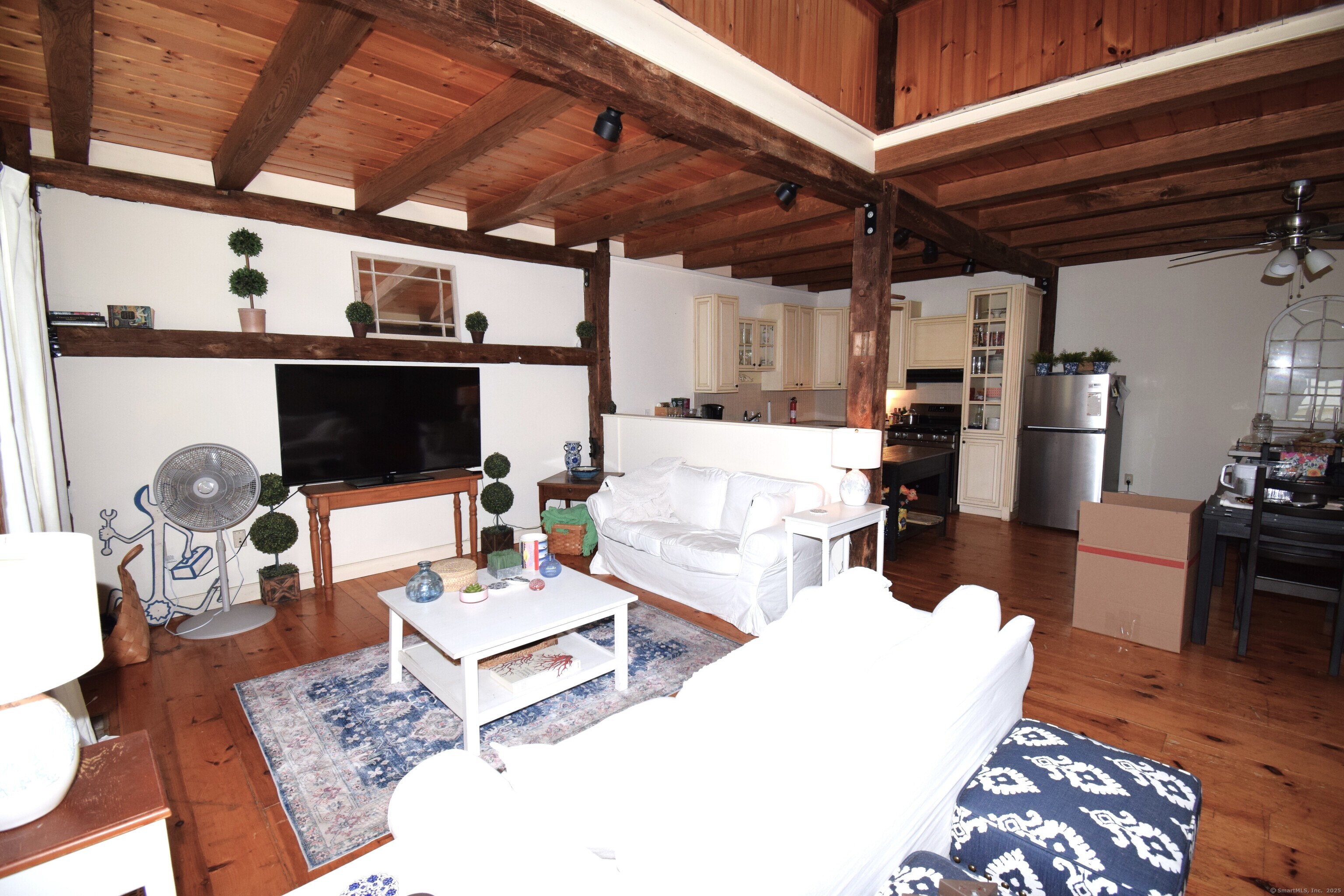 1306 Boston Post Road Westbrook, CT 06498 - Photo 3 of 12 a living room with furniture appliances and wooden floor