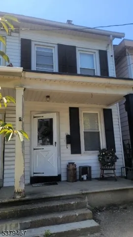 a view of a building with car parked