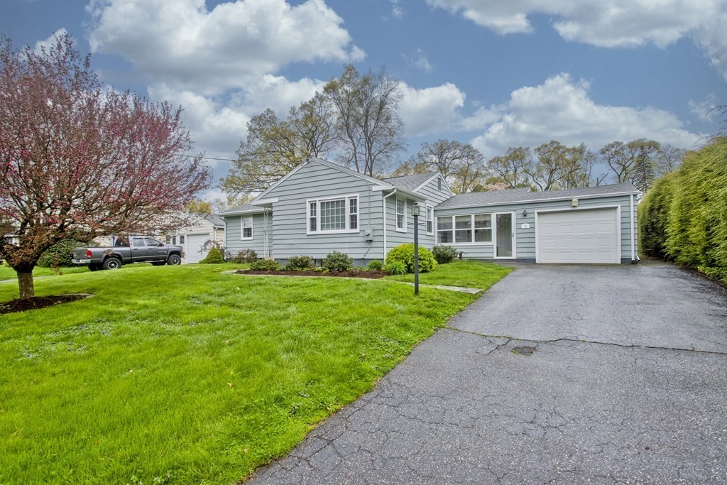 30 Endecott Street Springfield, MA 01118 - Photo 1 of 40 a front view of house with yard and green space