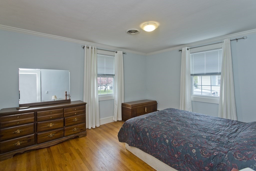 30 Endecott Street Springfield, MA 01118 - Photo 13 of 40 a bedroom with a bed and a dresser
