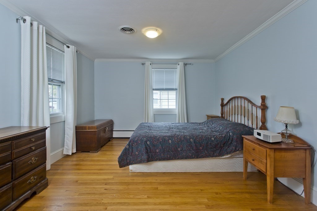 30 Endecott Street Springfield, MA 01118 - Photo 14 of 40 a bedroom with a bed and a window