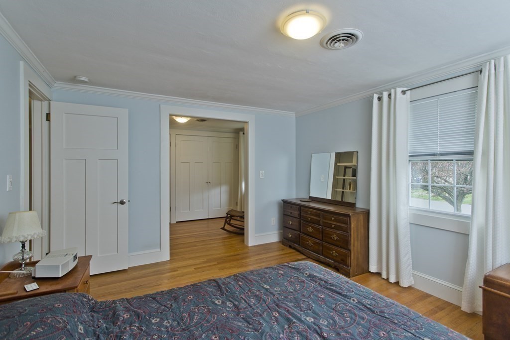30 Endecott Street Springfield, MA 01118 - Photo 16 of 40 a view of a livingroom with wooden floor and cabinet