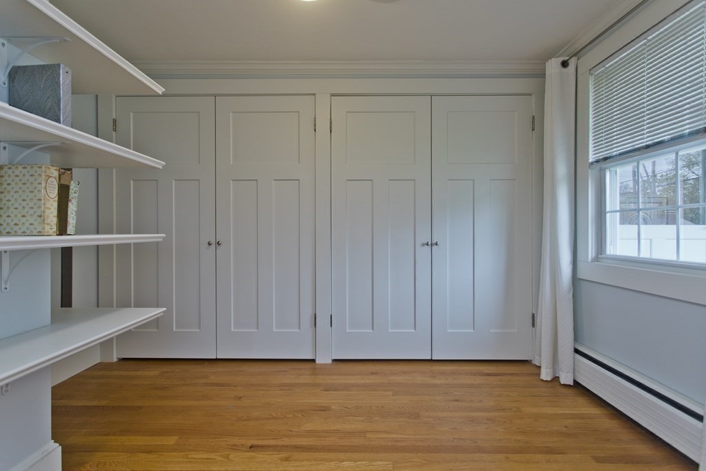 30 Endecott Street Springfield, MA 01118 - Photo 18 of 40 a view of an empty room with wooden floor and a window