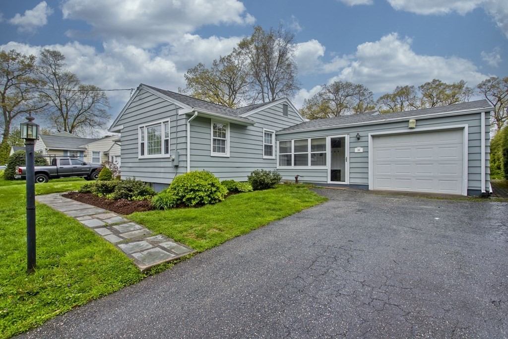 30 Endecott Street Springfield, MA 01118 - Photo 2 of 40 a front view of a house with a yard and garage