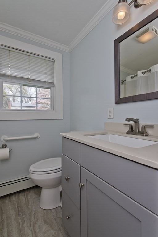 30 Endecott Street Springfield, MA 01118 - Photo 22 of 40 a bathroom with a toilet sink and mirror