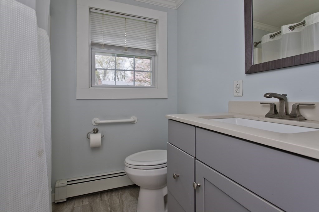 30 Endecott Street Springfield, MA 01118 - Photo 23 of 40 a bathroom with a toilet sink and mirror