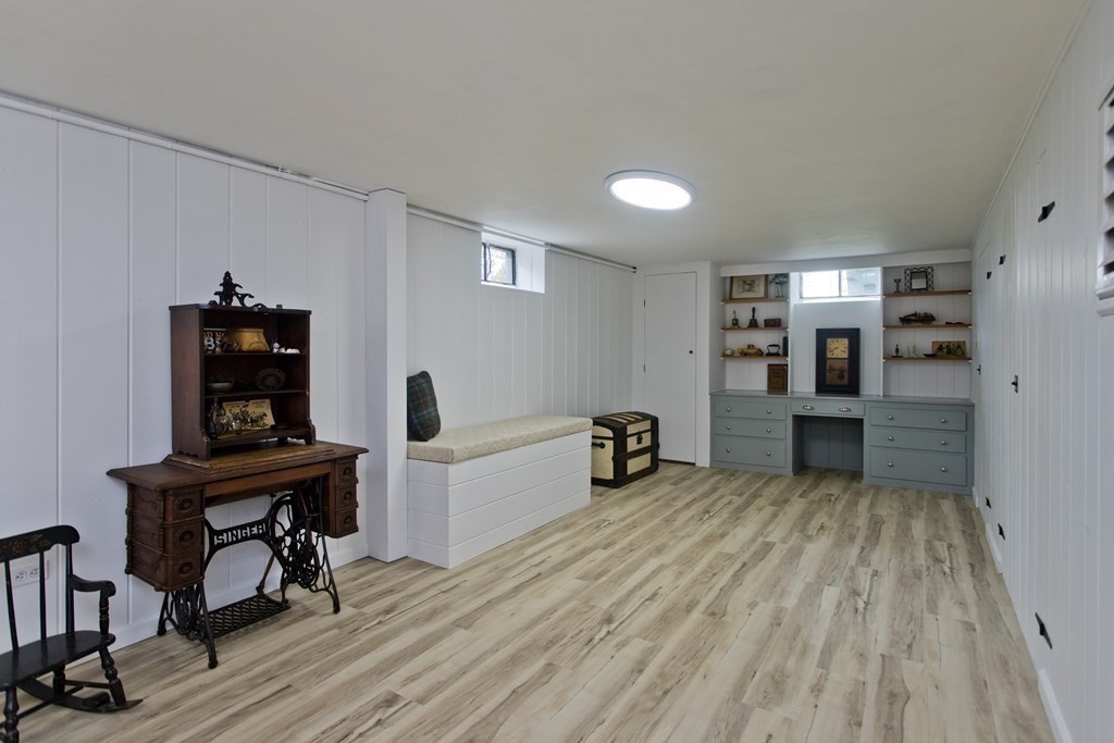 30 Endecott Street Springfield, MA 01118 - Photo 31 of 40 a view of a workspace with furniture and wooden floor