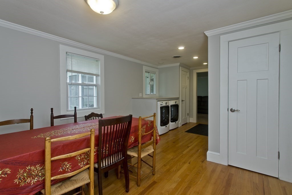 30 Endecott Street Springfield, MA 01118 - Photo 5 of 40 a view of a dining room with furniture and a kitchen