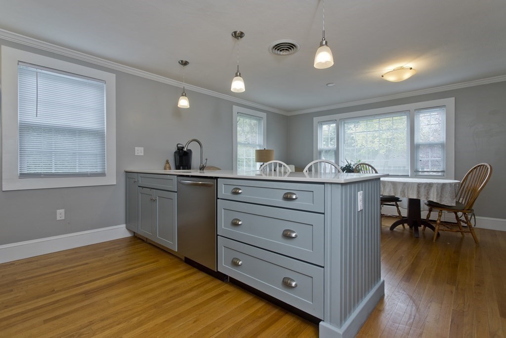 30 Endecott Street Springfield, MA 01118 - Photo 7 of 40 a kitchen with a wooden floor and breakfast area