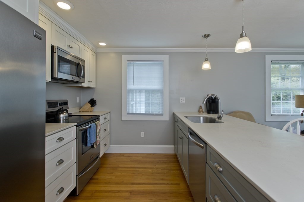 30 Endecott Street Springfield, MA 01118 - Photo 8 of 40 a kitchen with a stove and a sink