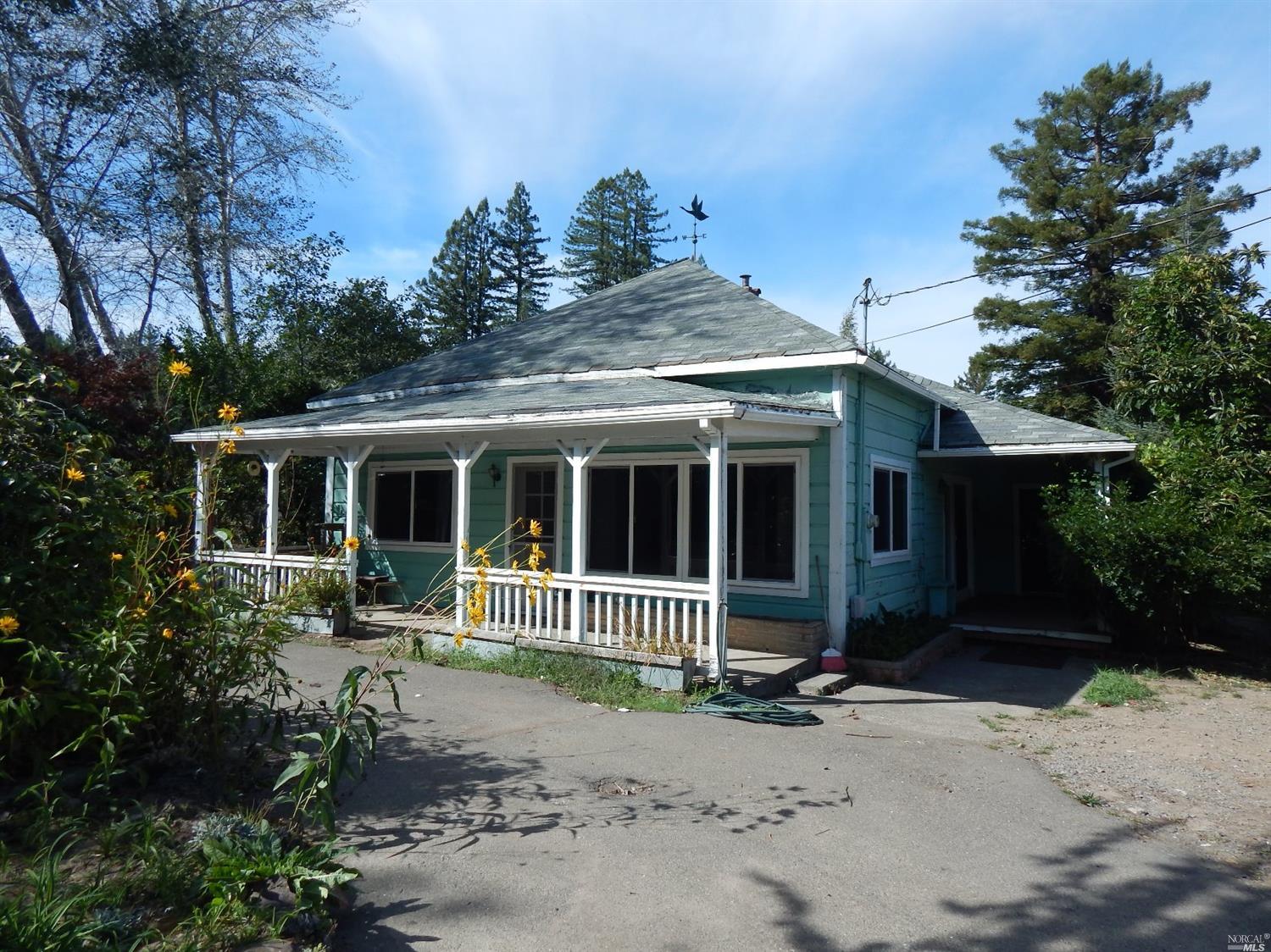 12820 Occidental Road Sebastopol, CA 95472 - Photo 1 of 1 a front view of a house with garden
