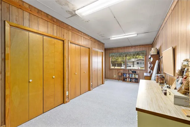 a view of a livingroom with furniture and a window