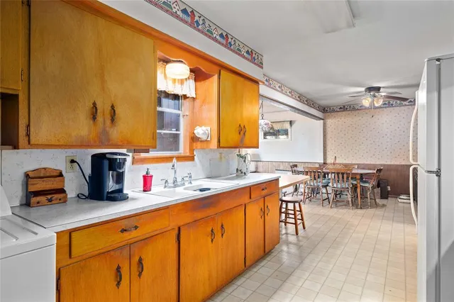 a kitchen with lots of counter top space and dining table