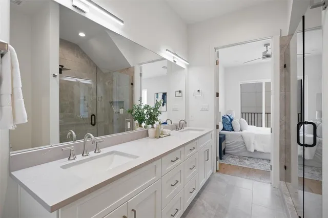 a spacious bathroom with a double vanity sink mirror and