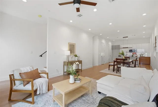 a living room with furniture and a table