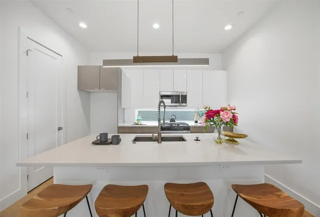 a kitchen with a table and chairs in it