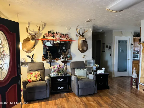 a living room filled with furniture and a fireplace