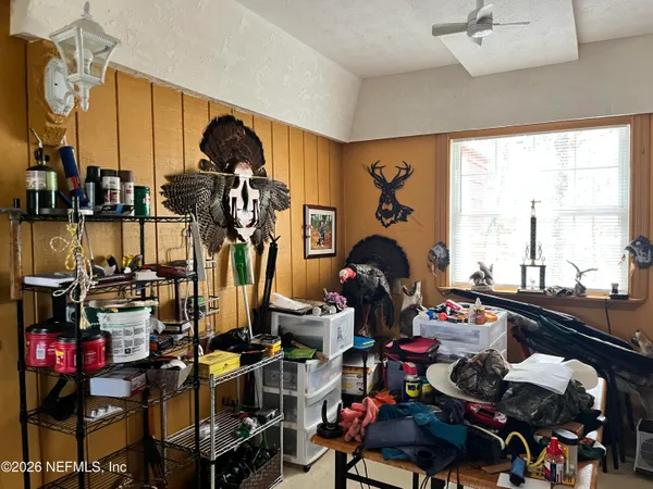 a very nice looking room with many windows and furniture