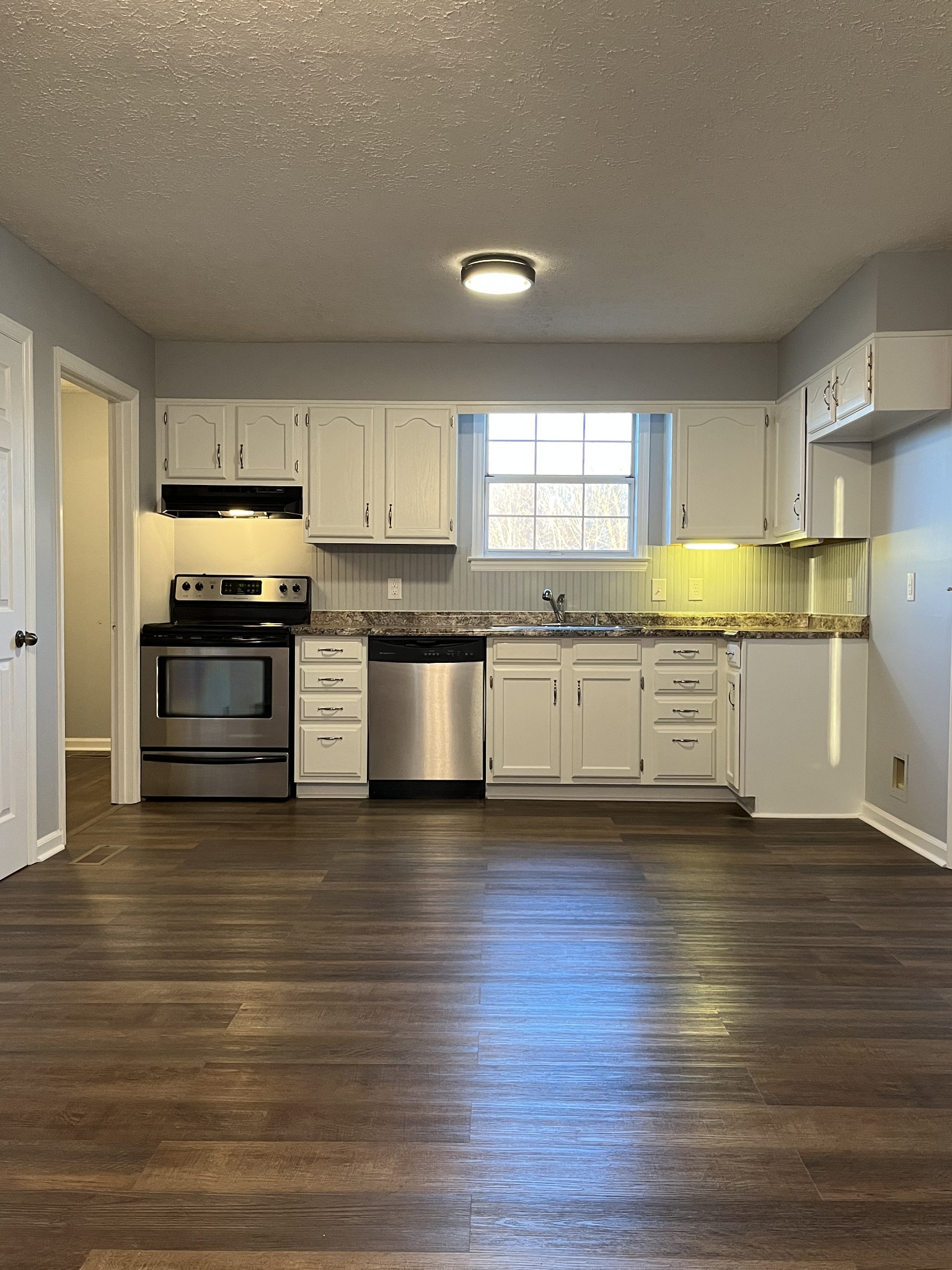 2741 Gideon Road Greenbrier, TN 37073 - Photo 4 of 12 a kitchen with stainless steel appliances granite countertop a stove and a sink