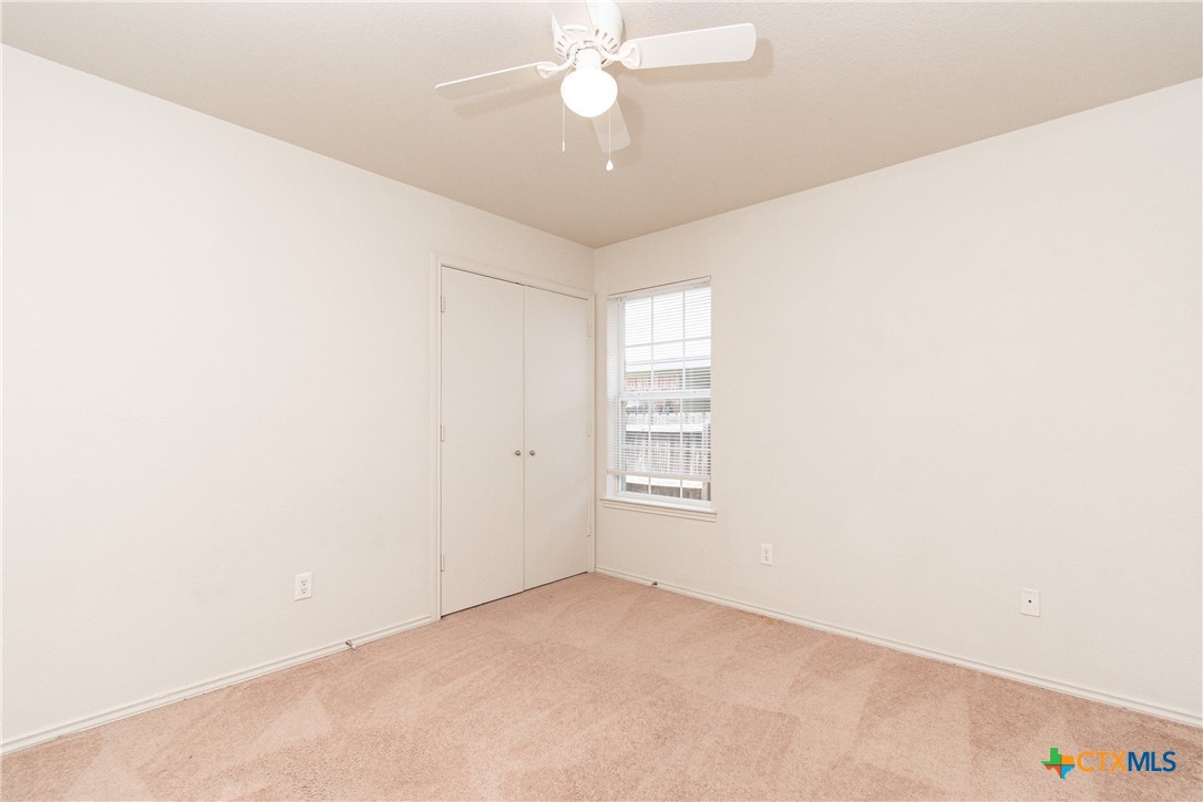 6509 Temora Loop, Unit A Killeen, TX 76549 - Photo 8 of 19 an empty room with windows and fan