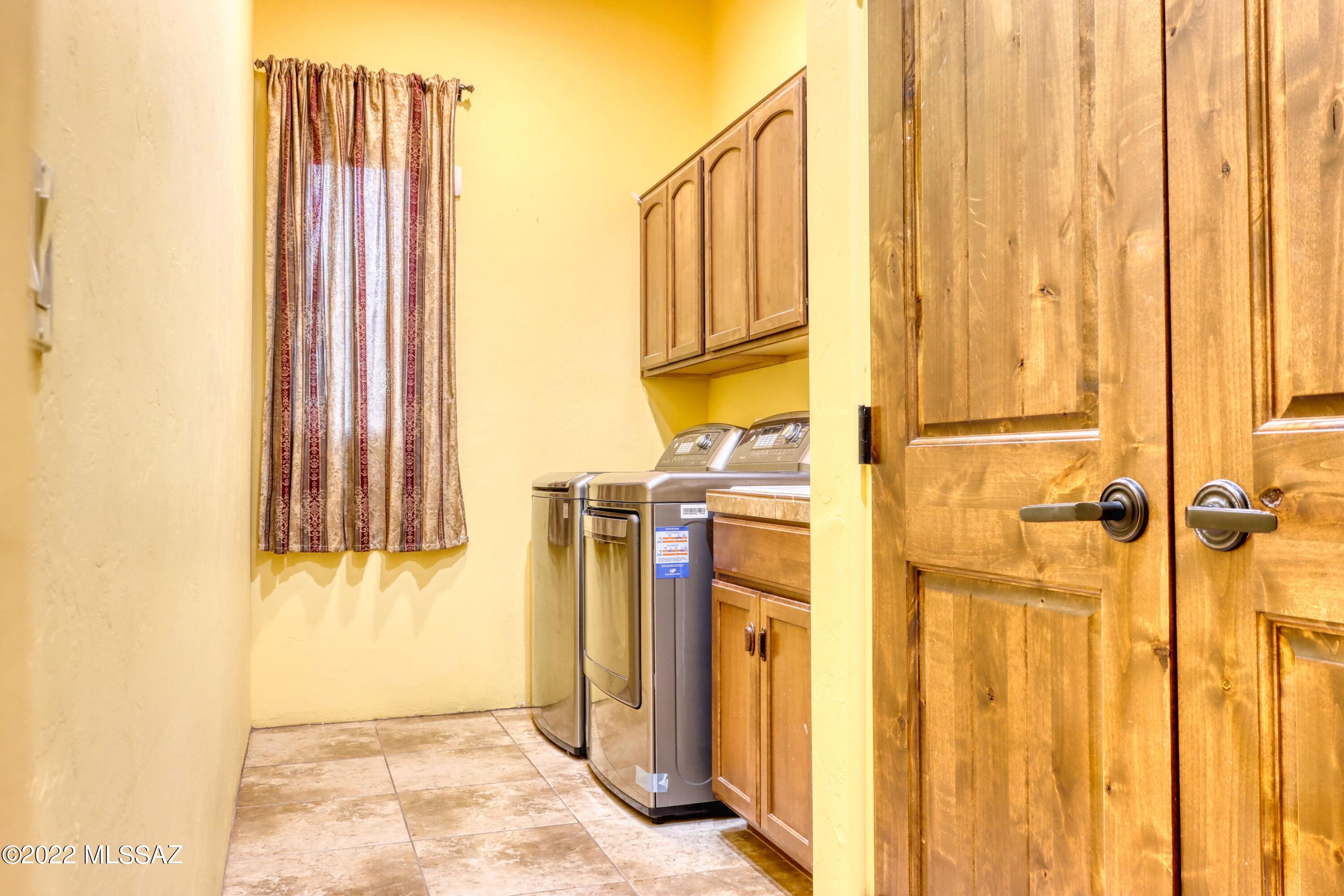 15393 East Hillton Ranch Road Vail, AZ 85641 - Photo 21 of 28 a view of a bathroom with a sink and a window