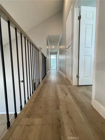 a view of a livingroom with furniture wooden floor and chandelier