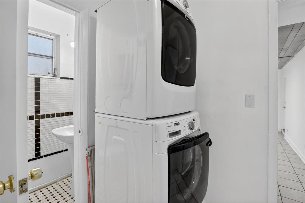 4631 Southwest 54th Terrace Davie, FL 33314 - Photo 16 of 42 a utility room with dryer and washer