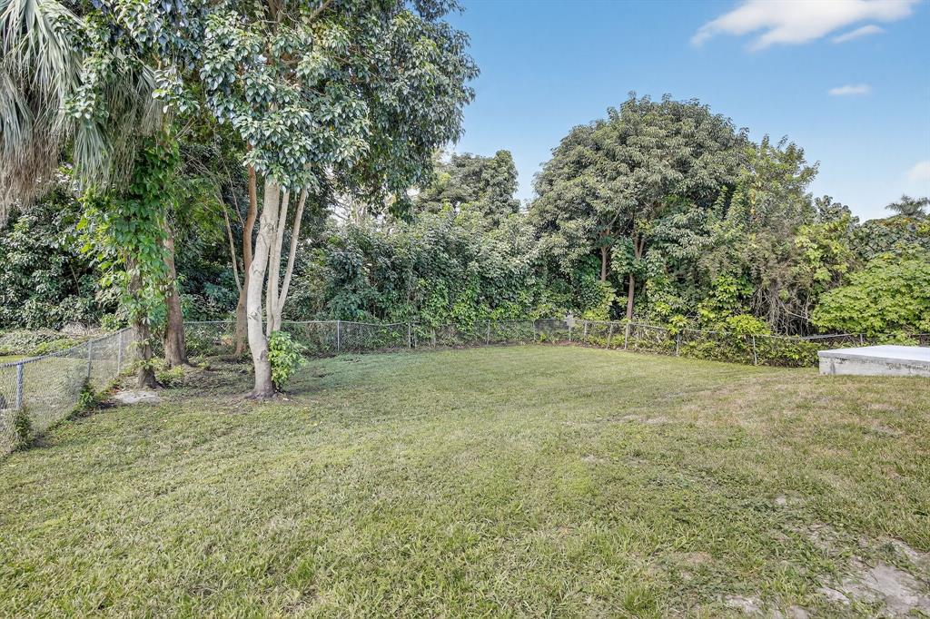 4631 Southwest 54th Terrace Davie, FL 33314 - Photo 31 of 42 a view of a yard with a tree