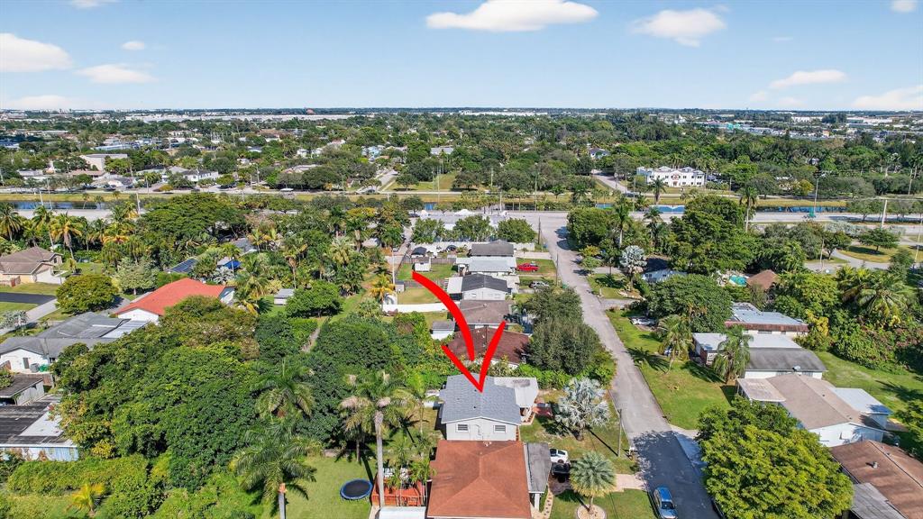 4631 Southwest 54th Terrace Davie, FL 33314 - Photo 37 of 42 an aerial view of residential houses with outdoor space and trees