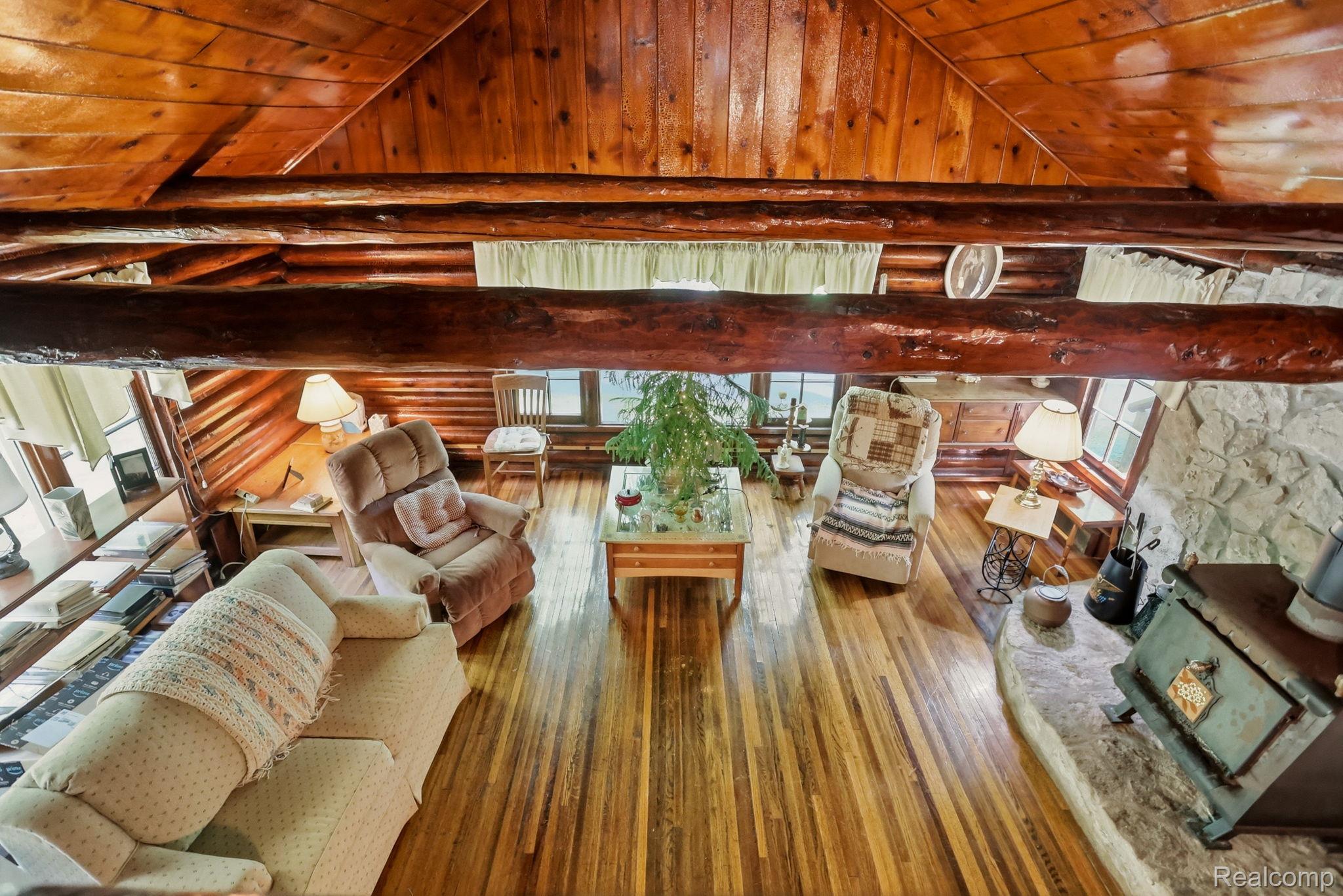 3814 South Towerline Road Bridgeport, MI 48722 - Photo 32 of 52 Vaulted wood-paneled ceiling with exposed log beams