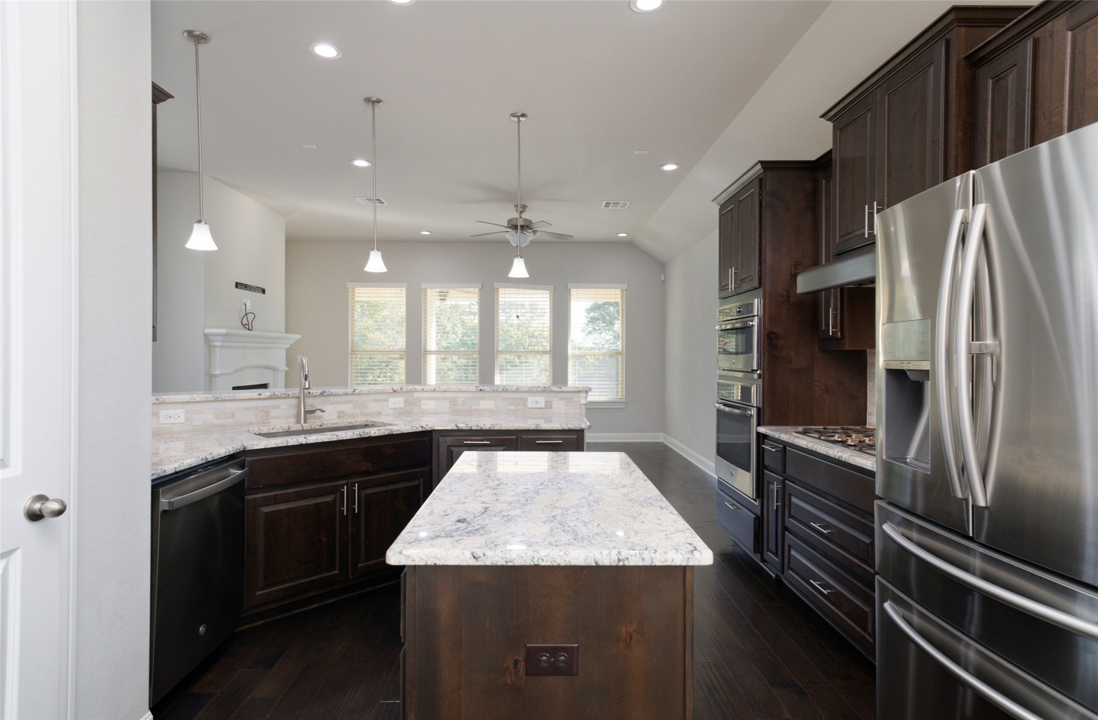 4001 Goodnight Trail Leander, TX 78641 - Photo 17 of 35 a kitchen with a sink stove and refrigerator