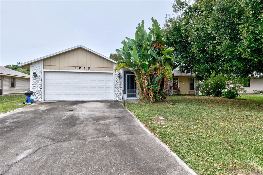 1055 Barber Street Sebastian, FL 32958 - Photo 11 of 18 a front view of house with a garden