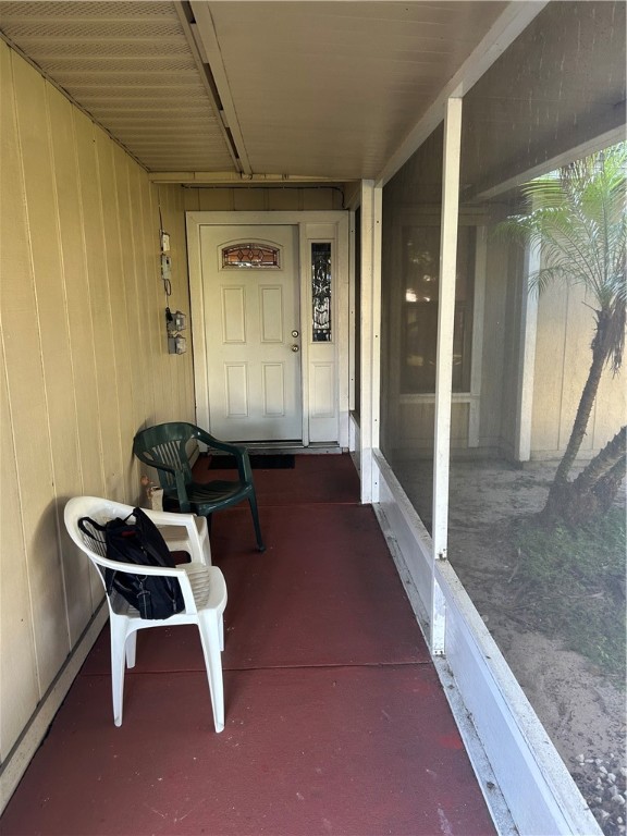 1055 Barber Street Sebastian, FL 32958 - Photo 12 of 18 a hallway with a table and chairs