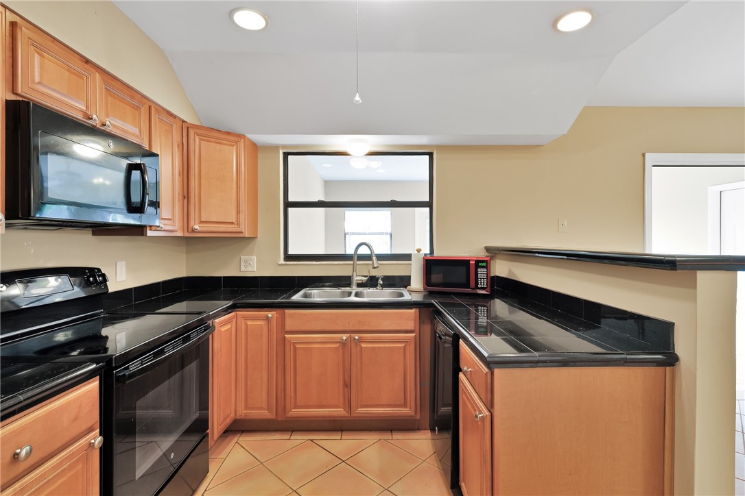 1055 Barber Street Sebastian, FL 32958 - Photo 18 of 18 a kitchen with granite countertop cabinets stainless steel appliances and a counter space